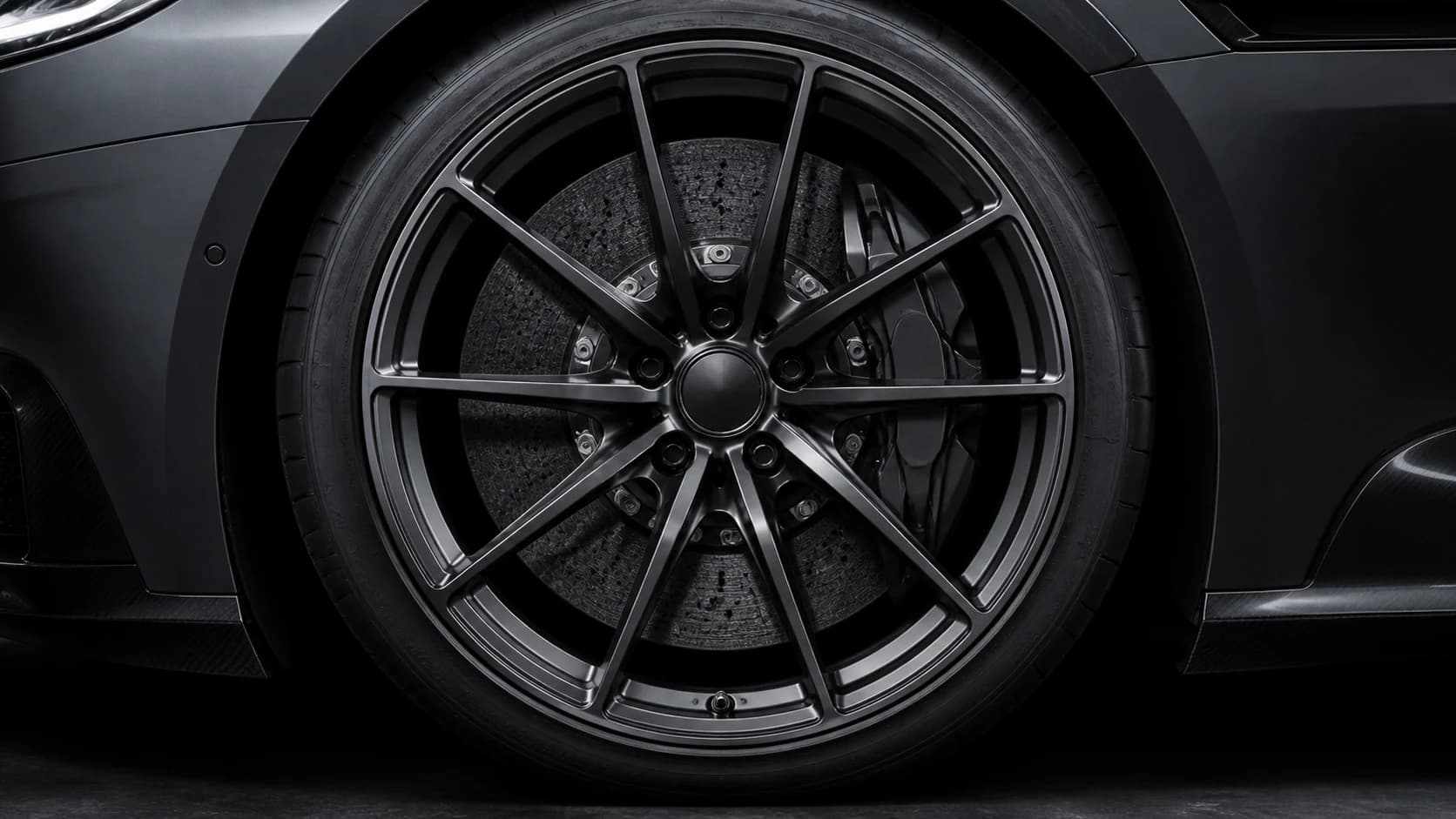 Close view of the Torren GT's carbon-ceramic front brake and forged 21-inch wheel