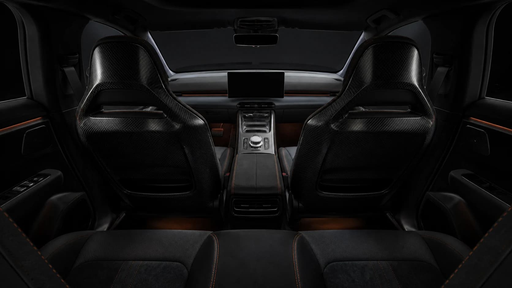 The Torren GT cabin showing its carbon shell seats and physical drive-mode rotary control